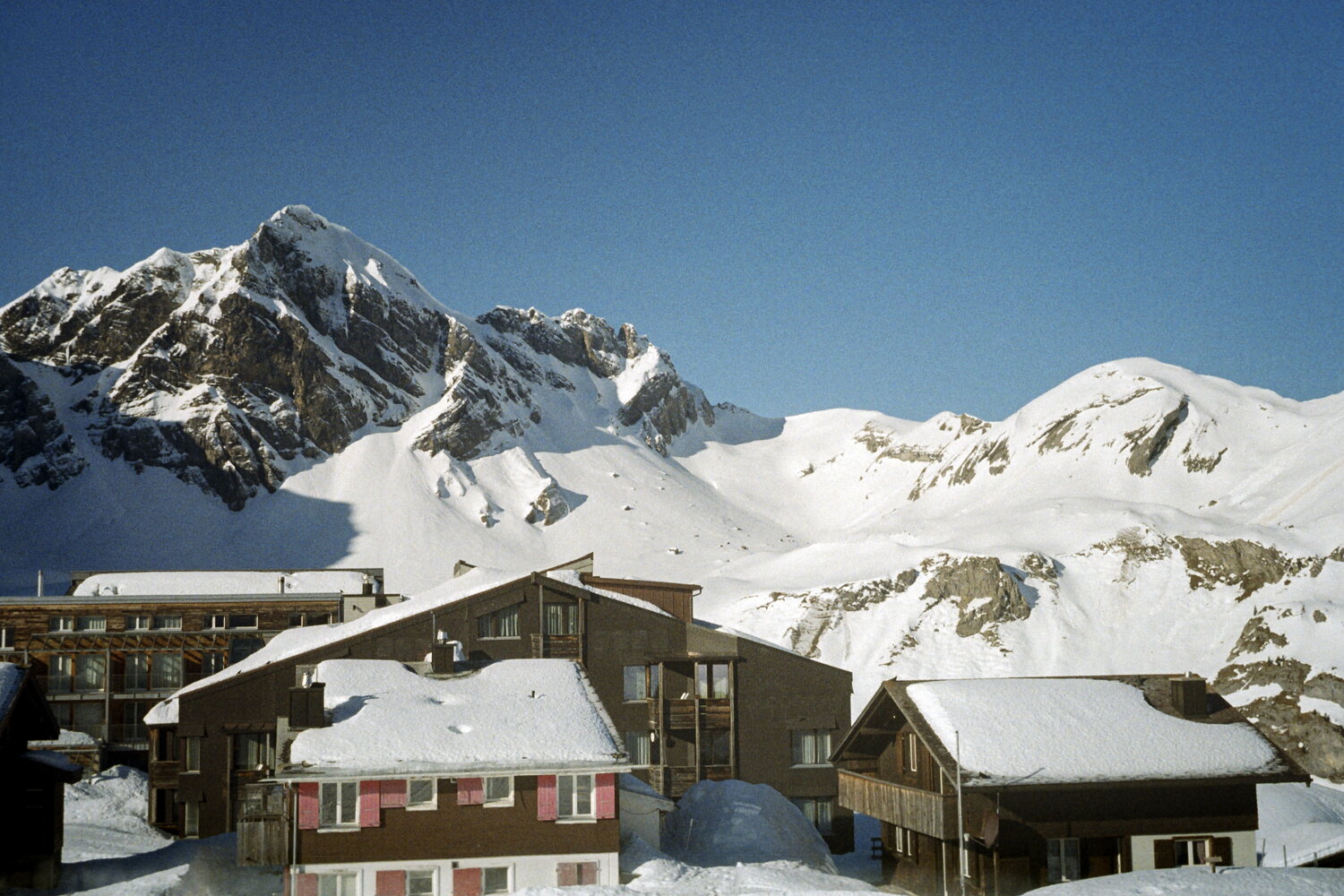 Snowbound chalets below the peaks of Melchsee-Frutt