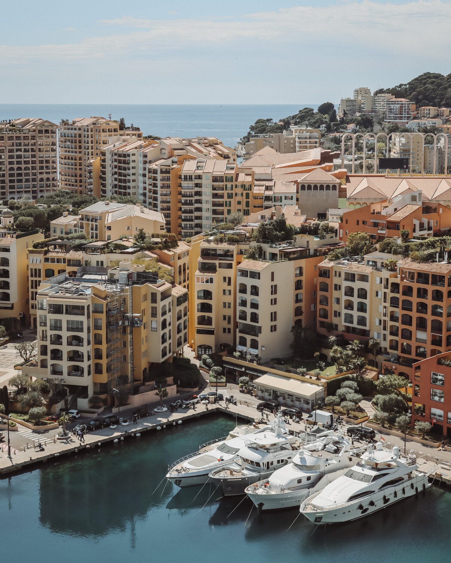 Yachts and ochre apartments on Monaco harbour