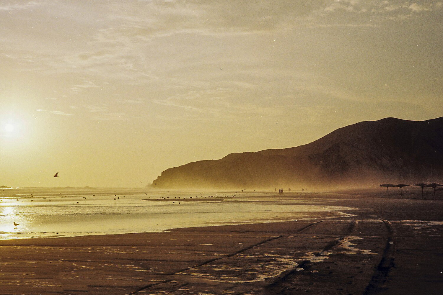 Low sun over a Pacific beach in Peru