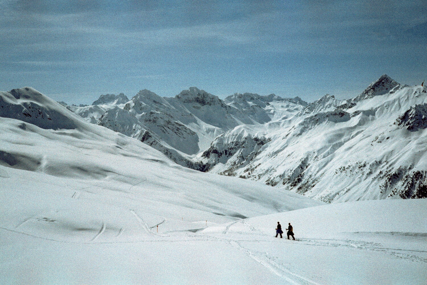 Tracks in the snow above a wide valley near Davos
